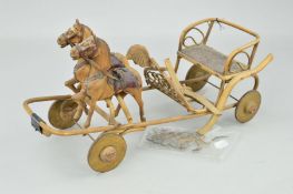 A VINTAGE WOODEN GALLOPING GIG PULL-ALONG TOY, of cane construction with metal wheels, two carved