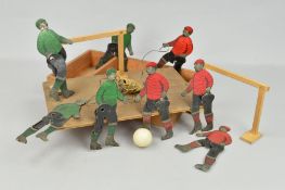 A LATE VICTORIAN/EDWARDIAN FOOTBALL GAME, four two colour lithographed cut-out tinplate players to