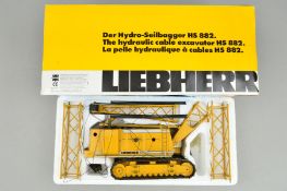 A BOXED CONRAD LIEBHERR HYDRAULIC CABLE EXCAVATOR HS 882, 1/50 scale, with instructions, requires