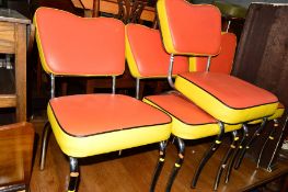 A SET OF FOUR CHROME FRAMED CHAIRS with orange and yellow vinyl