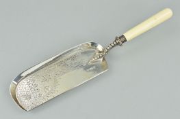 A LATE VICTORIAN SILVER CRUMB SCOOP, drape, tassel and leaf engraved decoration, turned ivory