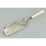 A LATE VICTORIAN SILVER CRUMB SCOOP, drape, tassel and leaf engraved decoration, turned ivory