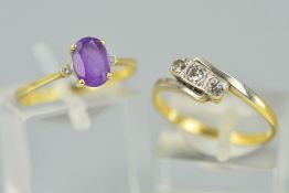 TWO GEM SET RINGS, the first designed as a central oval amethyst flanked by small circular