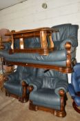 AN OAK FRAMED DARK BLUE THREE PIECE SUITE with a matching oak coffee table (4)