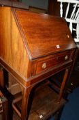 AN EDWARDIAN MAHOGANY AND INLAID LADIES BUREAU with a single drawer on square supports united by a