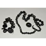 THREE ITEMS OF JET JEWELLERY to include a graduated, faceted bead necklace, length 670mm, a