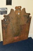 A VICTORIAN CAST IRON FIRE BACK with central putti and coat of arms above, approximate size 78cm x