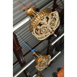 A SET OF THREE BRASS AND GLASS CEILING LIGHTS of a foliate design