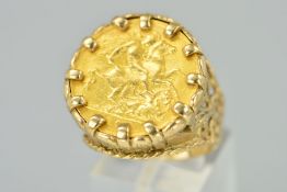 A GOLD HALF SOVEREIGN RING, the half sovereign within a claw setting, to the fancy ring mount with