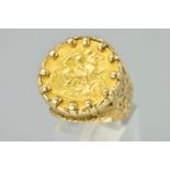 A GOLD HALF SOVEREIGN RING, the half sovereign within a claw setting, to the fancy ring mount with