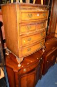 A REPRODUCTION WALNUT CHEST OF FOUR LONG DRAWERS (distressed), a mahogany serpentine two door