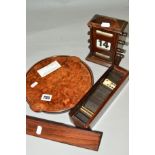 AN EDWARDIAN OAK PERPETUAL CALENDAR, a John Makepeace circular burr elm and burr Chestnut circular