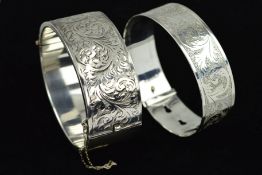 TWO SILVER BANGLES, the first a Charles Horner buckle style design bangle, engraved with scrolling