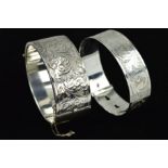 TWO SILVER BANGLES, the first a Charles Horner buckle style design bangle, engraved with scrolling