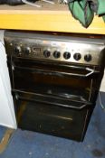 AN INDESIT ELECTRIC COOKER width 60cm