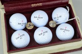 GOLFING INTEREST:- A PAIR OF ELIZABETH II SILVER GOLF TEES and six 'Top Flight' golf balls in a 'TOP