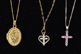 THREE PENDANTS, the first a cross pendant set with stones assessed as pink sapphires, suspended from