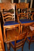 A SET OF SIX OAK AMERICAN STYLE DINING CHAIRS including two carvers
