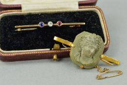 TWO EARLY 20TH CENTURY BROOCHES to include a 9ct gold bar brooch set with a sapphire, diamond and