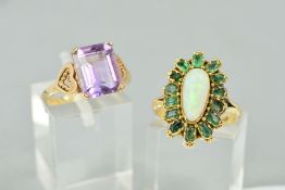 TWO GEM SET RINGS, the first designed with a central pear shape opal cabochon within an emerald (