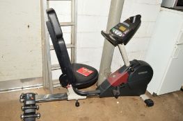 A PRO-FORM CROSSTRAINER 970 EXCERCISE MACHINE including six small hand weights
