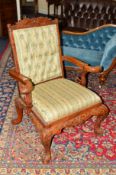 A REPRODUCTION CARVED MAHOGANY ARMCHAIR, the arms and front legs with a moulded mythical creature,