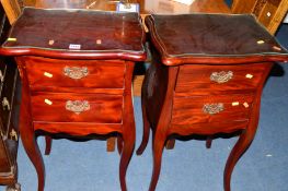 A PAIR OF REPRODUCTION MAHOGANY TWO DRAWER BEDSIDE CABINETS on raised legs