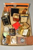 A SMALL BOX OF MISCELLANEOUS ITEMS to include travel clocks, table lighters, a plastic lighter