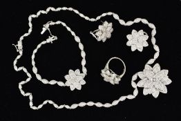 A SUITE OF COSTUME JEWELLERY INCLUDING PENDANT, EARRINGS, RING AND BRACELET