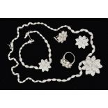 A SUITE OF COSTUME JEWELLERY INCLUDING PENDANT, EARRINGS, RING AND BRACELET