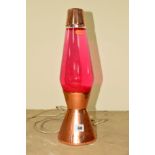 A CRESTWORTH COPPER LAVA LAMP FILLED WITH RED WATER, approximate height 43cm (works but not PAT