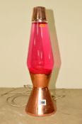 A CRESTWORTH COPPER LAVA LAMP FILLED WITH RED WATER, approximate height 43cm (works but not PAT