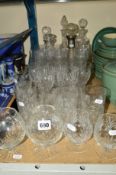 A QUANTITY OF CUT GLASS etc, to include five decanters and drinking glasses