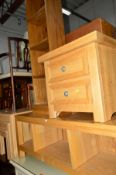 A LIGHT OAK SIDE UNIT, width 110cm, a two drawer bedside chest, an open bookcase and a modern