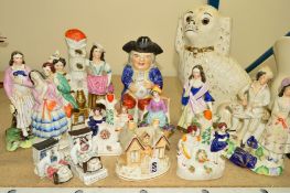 THIRTEEN STAFFORDSHIRE STYLE FIGURES, to include a toby jug with lid, posy vases, fairings