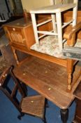 AN OAK LINENFOLD TELEPHONE TABLE/SEAT, an oak table, an oak cane seated prayer chair and another