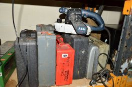 A COLLECTION OF CASED ELECTRIC HAND TOOLS to include drills and an AEG BBS 1100 hand sander (some