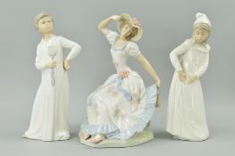 TWO NAO FIGURES, girl with torn nightgown, approximate height 29.5cm and boy in nightgown with fly
