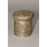A LATE 19TH/EARLY 20TH CENTURY INDIAN WHITE METAL CYLINDRICAL BOX AND COVER, embossed with buildings