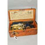 A CASED VICTORIAN MEDICAL 'IMPROVED MAGNETIC ELECTRIC MACHINE' missing lock, some damage to wooden