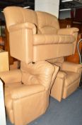 A G-PLAN TAN LEATHER THREE PIECE LOUNGE SUITE, comprising of a two seater settee, an electric