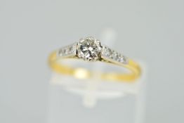 A DIAMOND RING, designed as a brilliant cut diamond within an eight claw setting, the shoulders each