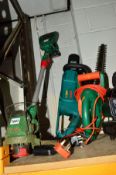 A BOSCH ELECTRIC CHAINSAW, a Qualcast battery strimmer and a Black and Decker GT25 hedge trimmer (