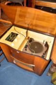 A BUSH WALNUT GRAMOPHONE with a serpentine front and Garrard turntable