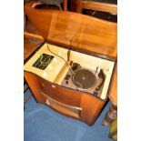 A BUSH WALNUT GRAMOPHONE with a serpentine front and Garrard turntable