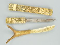 A JAPANESE TANTO, with figural carved handle and sheath, a.f., blade length 16cm approximately,