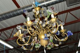A MODERN BRASS AND COLOURED GLASS CHANDELIER