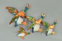 A SET OF FOUR GRADUATED BESWICK 'MALLARD' WALL PLAQUES, Nos 596/1, 596/2, 596/3 and 596/4