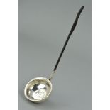 A LATE GEORGIAN SILVER LADLE, the bowl centrally set with an 1818 George III coin with a twisted
