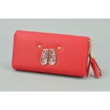 A LADIES RED PURSE (BUNNY DESIGN TO FRONT)